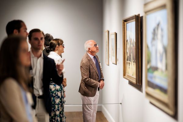Man Close Inspection of Painting 600x400