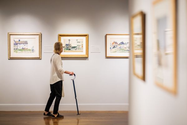 Woman with Walking Aid Enjoying Gallery 600x400